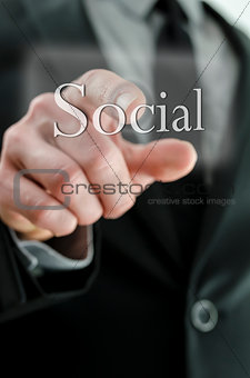 Male hand  pressing Social icon on a virtual screen