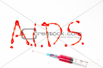 Aids spelled out in blood with syringe