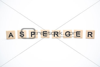 Asperger spelled out in plastic letter pieces