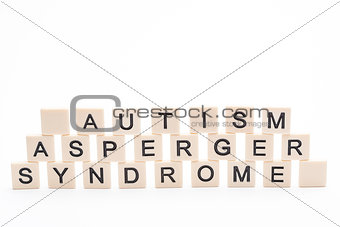 Autism asperger syndrome spelled out in plastic letter pieces