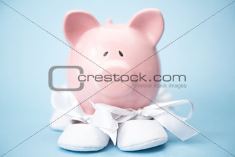 Piggy bank wearing baby booties