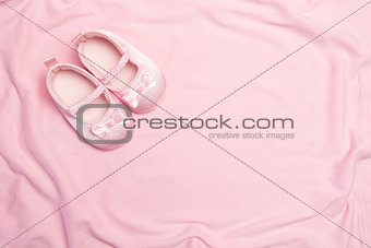 Pink blanket and baby slippers