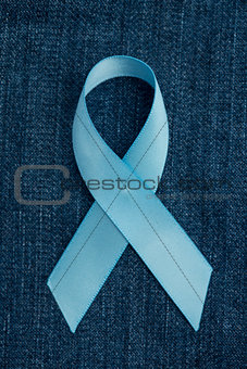Blue ribbon for prostate cancer awareness on demin