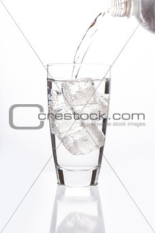 Sparkling water filling glass