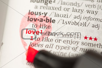 Love definition circled with a red heart