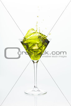 Cocktail glass with yellow alcohol