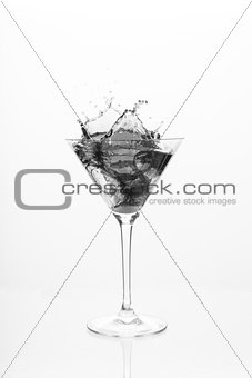Cocktail glass overflowing in black and white