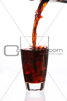 Soda being poured in a glass