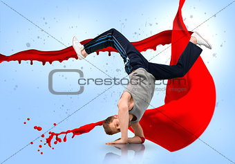 Break dancer balancing on his forearms with reflection below