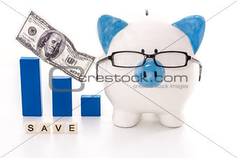 Piggy bank wearing glasses with save message