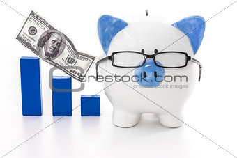 Piggy bank wearing glasses with blue graph model