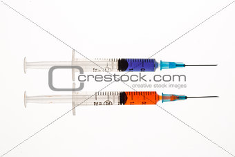 Two syringes beside each other