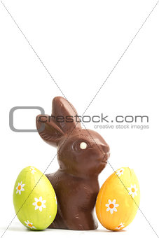 Chocolate bunny with two easter eggs
