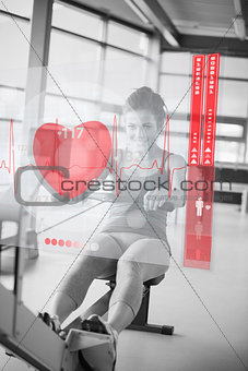 Young girl doing rowing machine with futuristic interface in black and white