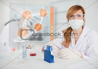Chemist working in protective suit with futuristic interface showing DNA