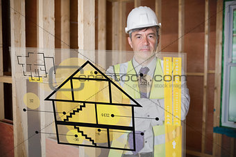 Architect standing behind house plan interface