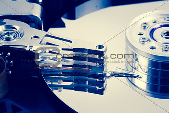 Close up of hard disk drive in blue tint