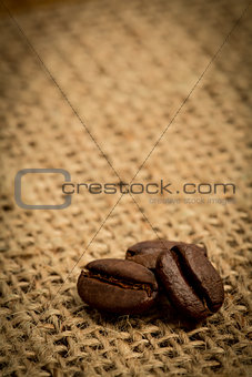 Three coffee beans with copy space