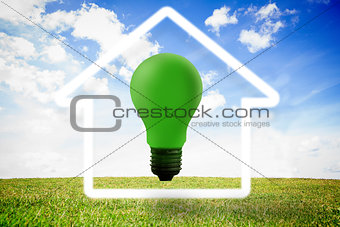 Green light bulb with white house outline