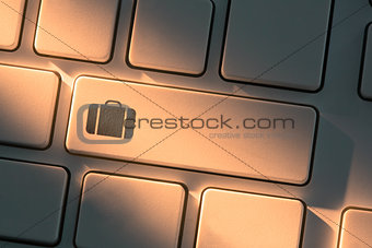 Keyboard with close up on briefcase symbol
