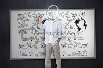Man with light bulb instead of head in front of white board