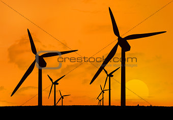 Wind turbines with a sunset in two lines