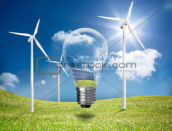 Light bulb showing solar panels and turbines in a field with wind turbines