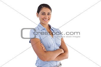 Smiling businesswoman crossing her arms