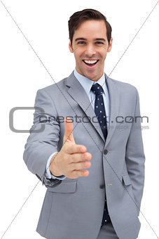 Attractive businessman giving a helping hand