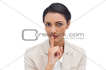 Young businesswoman asking for silence