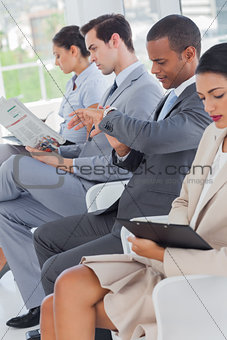Business people sat in line