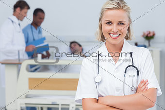 Blonde nurse crossing her arms