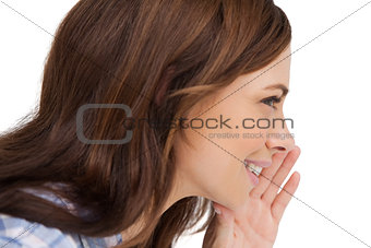 Brunette woman whispering a secret