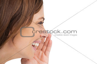 Side view of a woman whispering a secret