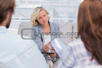 Therapist giving tissue to a woman