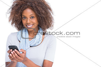Attractive brunette typing a text message