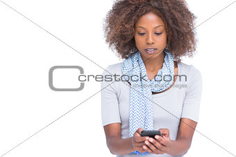 Concentrated woman typing a text message