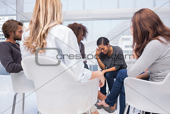 Woman crying at group therapy