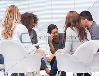 Therapist taking notes while patient crying