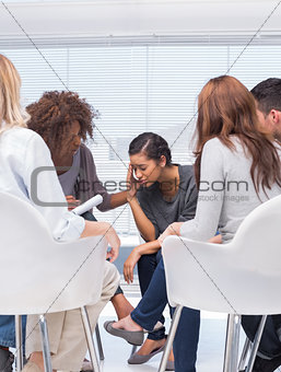 Therapist encouraging a patient