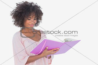 Beautiful woman looking at photo album