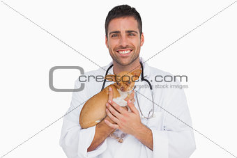 Happy vet holding chihuahua