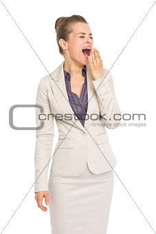Portrait of business woman yawing
