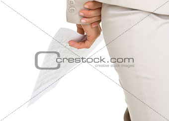 Closeup on document in hand of business woman
