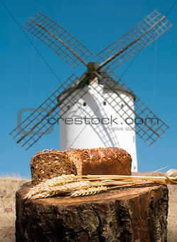 Different breads and windmill in the background
