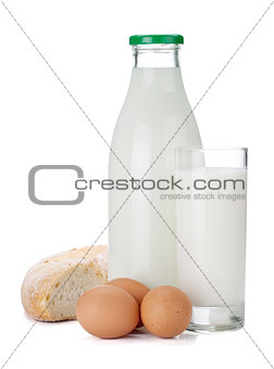 Milk bottle, glass, bread and eggs