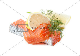 Two salmon pieces with lemon and dill