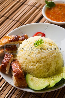 singapore hainan chicken rice with materials as background