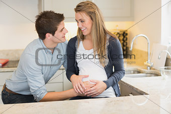 Young happy pregnant woman with  husband