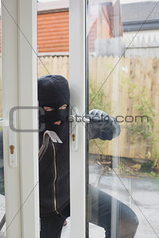 Burglar opening the terrace door
